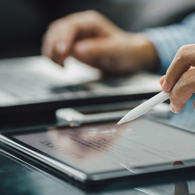 businessman hand signing agreement contract document electronic signature on digital tablet